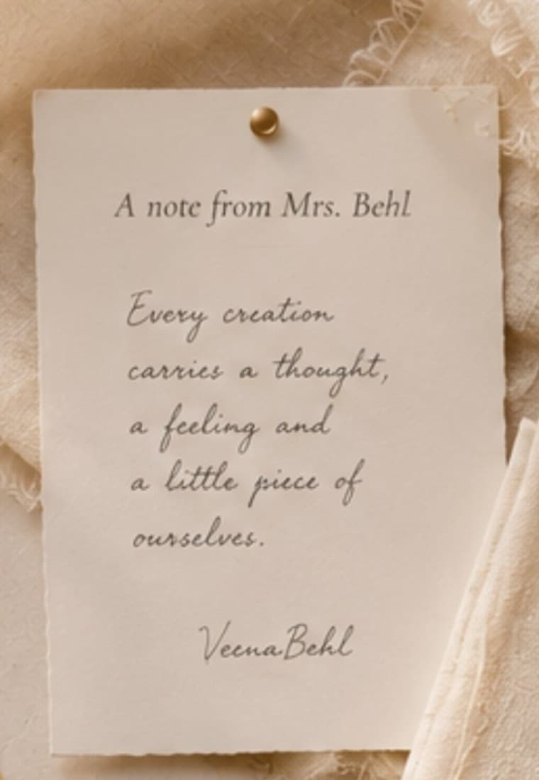 A handwritten note from Mrs. Veena Behl: 'Every creation carries a thought, a feeling and a little piece of ourselves.'